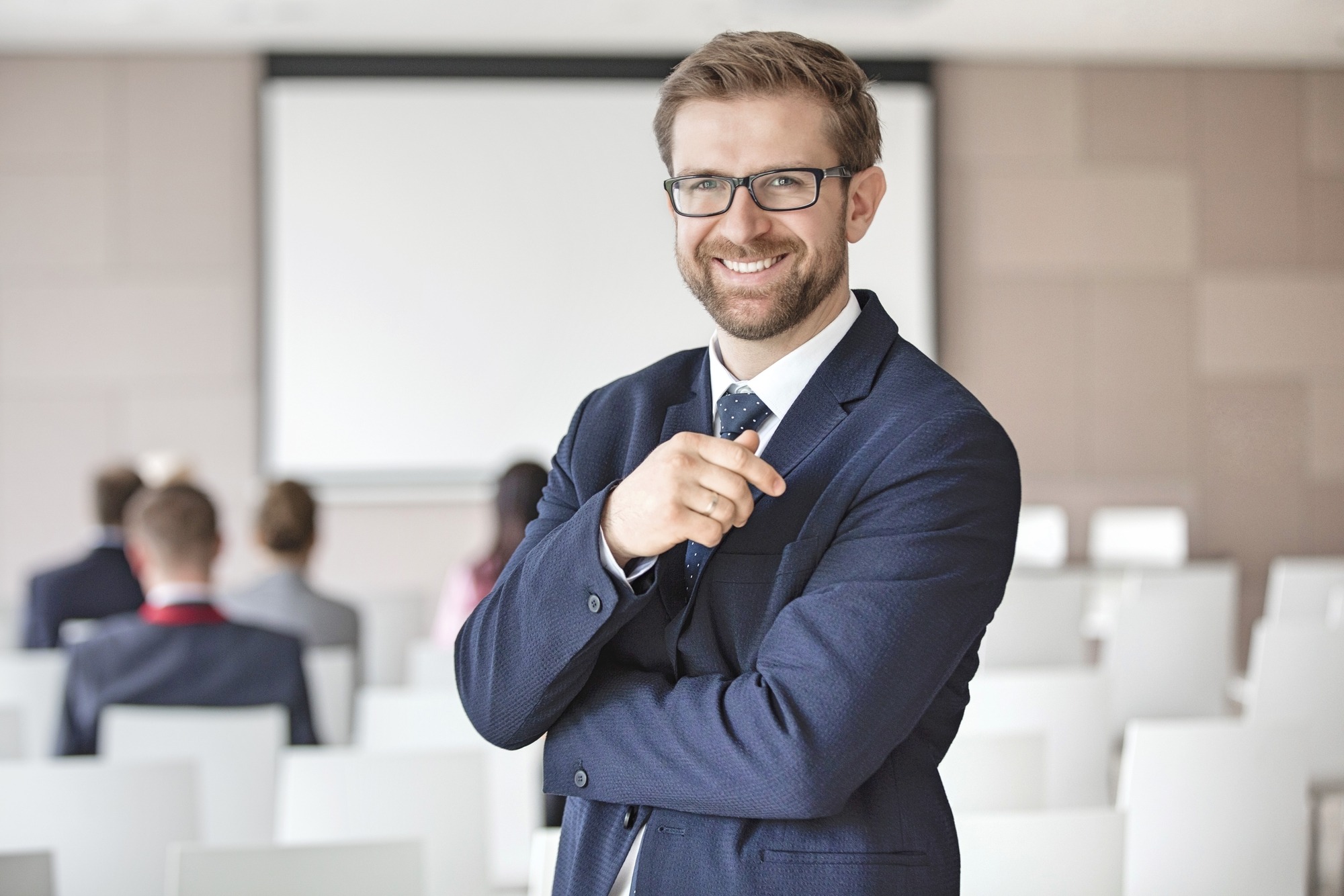 Portrait of happy businessman standing
